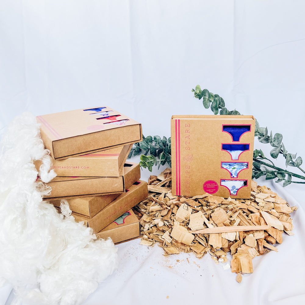 Stripe & Stare underwear in recycled boxes stacked on top of eachother